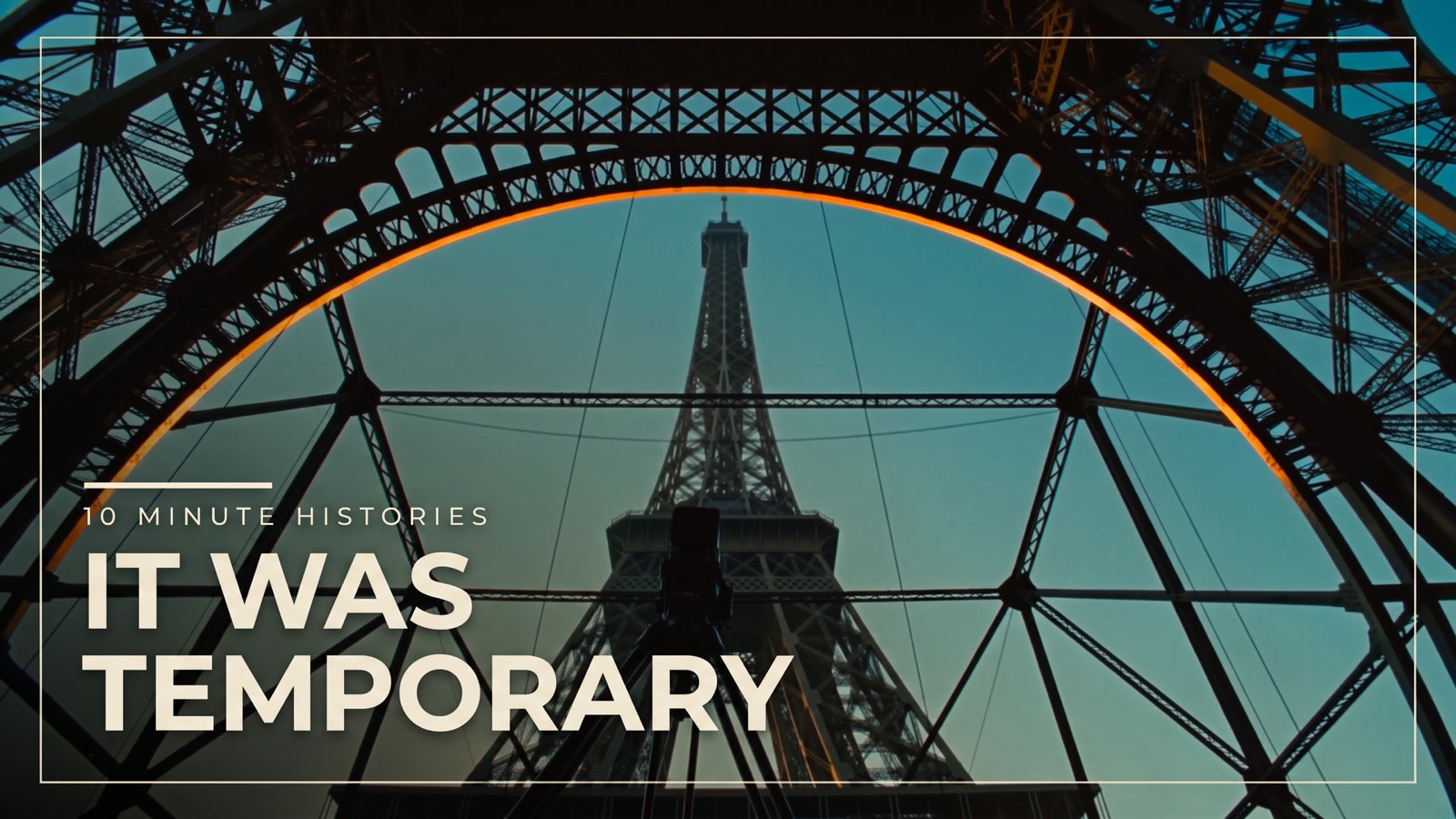Beneath the Eiffel Tower's arch at dusk — It Was Temporary, episode 1 of 10 Minute Histories